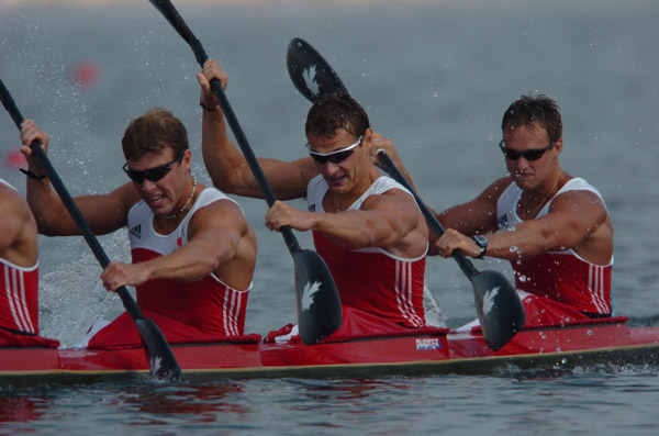 Canada's Ryan Cuthbert , Steven Jorens and Andrew Willows paddle in the K4 1000m final in Schinias at the 2004 Summer Olympic Games in Athens, Greece, on Friday, August 27, 2004. Canada's team came in ninth. (CP PHOTO 2004/Andre Forget/COC)