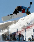Canadian Mike Michalchuk of Calgary pulls a trick while riding the  half pipe at Park City, Utah Monday  Feb. 11, 2002 at the Salt Lake City 2002 Winter Olympics. (CP Photo/HO/COA/Andre Forget)