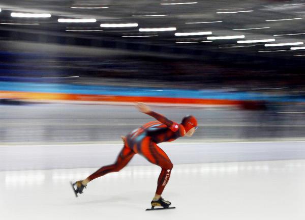 Team Canada's long track speed skater Dustin Molicki powers on to beat teammate Mark Knoll for the Canadian record with a time of 6:26.29 in the 5,000 metre mens final at the Olympic Winter Games in Salt Lake City, Utah Saturday Feb. 9, 2002. (CP Photo/HO