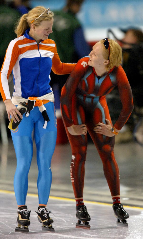 Cindy Klassen (right) of Winnipeg is congratualted on her bronze medal in the women's 3,000 metre speed skating long-track by Tonny de Jong of the Netherlands at the Winter Olympics at the Utah Olympic Oval in Salt Lake City, Sun., Feb. 10, 2002. (CP Phot