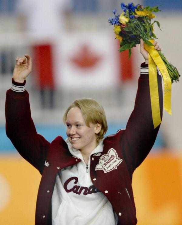 Cindy Klassen of Winnipeg celebrates her bronze medal in the women's 3,000 metre long-track speed skating in the Winter Olympics at the Utah Olympic Oval in Salt Lake City, Sunday Feb. 10, 2002. Klassen won Canada's first medal of the Olympics. (CP Photo/