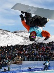 Canadian Mike Michalchuk of Calgary pulls a trick while riding the half pipe at Park City, at 2002 Olympic Winter Games in Salt Lake City . (CP Photo/COA/Andre Forget).
