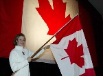 Canada's Catriona Le May Doan of Saskatoon, the Canadian Olympic team flag bearer for the opening ceremonies, waves the flag at the Canadian team reception in Salt Lake City, Wed., Feb. 6, 2002.  (CP PHOTOHO/COA/Mike Ridewood)