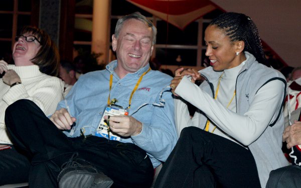 Canadian IOC members Charmaine Crooks (right), Dick Pound and Canadian Olympic team Chef de Mission Sally Rehorick (left) react to streamer falling from the ceiling at the conclusion of the Canadian Olympic team reception in Salt Lake City, Wed. Feb. 6, 2