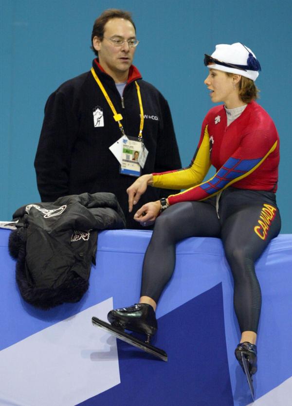 Canada's Catriona Le May Doan of Saskatoon talks with Canadian coach Derrick Auch during speed skating training at the Salt Lake City Olympics on Thursday, Feb. 7, 2002.  (CP PHOTO/HO/COA/Mike Ridewood)