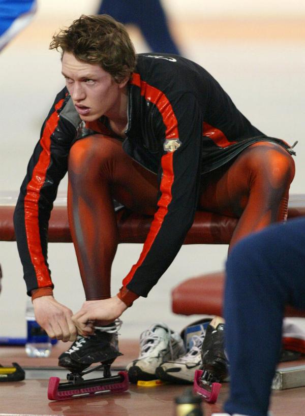 Jeremy Wotherspoon of Red Deer, Alta. removes his skates after slipping at the start of his men's 500-metre speed skating first heat at the XIX Olympic Winter Games in Salt Lake City, Utah, Monday, Feb. 11, 2002. (CP PHOTO/HO/COA/Mike Ridewood)