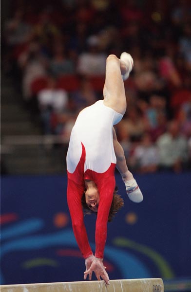Canada's Yvonne Tousek performs on the beam during gymnastics competition at the Sydney 2000 Olympic Games. (CP Photo/COA)