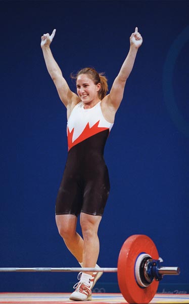 Canada's Maryse Turcotte celebrates after a lift in the women's 58 kg weightlifting competition at the Sydney Olympic Games on  Monday September 18, 2000.  (CP Photo/COA)