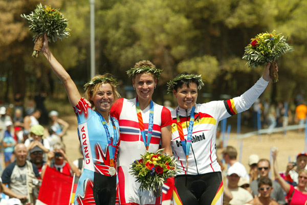 The three medallists in the women's mountain bike event at the Olympic Games in Athens, Friday, August 27, 2004, Norway's Gunn-Rita Dahle (gold), Canada's Marie-Helene Premont (silver) and Germany's Sabine Spitz (bronze) (CP PHOTO)2004(COC-Mike Ridewood)