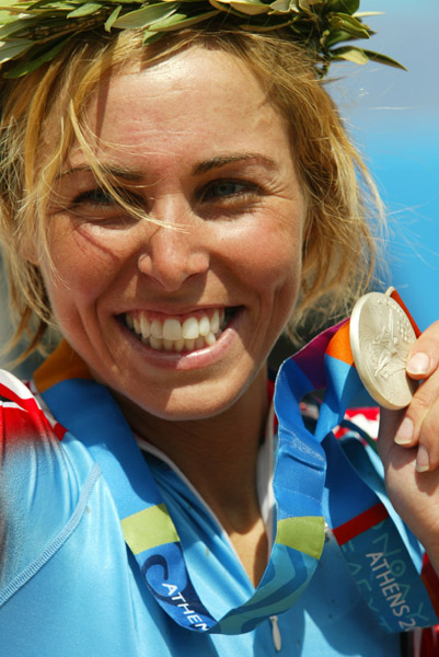 Canada's Marie-Helene Premont of Chateau-Richer, Que. shows her silver medal in women's mountain bike action at the Athens Olympics, Friday, August 27, 2004.(CP PHOTO/COC-Mike Ridewood)