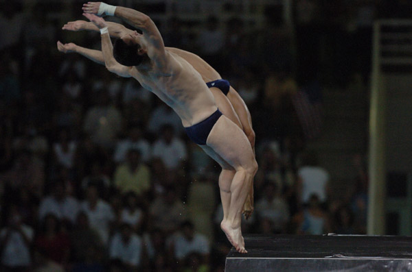 Alexandre Despatie and Philippe Comtois dive during the 10m synchronised diving at the Athens 2004 Summer Olympic Games August 14, 2004. (CP PHOTO 2004/Andre Forget/COC)