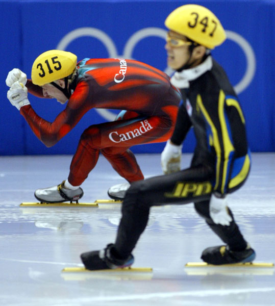 Canadian short track speed skater Marc Gagnon pumps his fist after winning the men's 500 metre Saturday Feb. 23, 2002 at the 2002 Olympic Winter Games in Salt Lake City. Canadian Gagnon went on to win gold for the 5,000 metre relay also. (CP Photo/COA/Andre Forget).