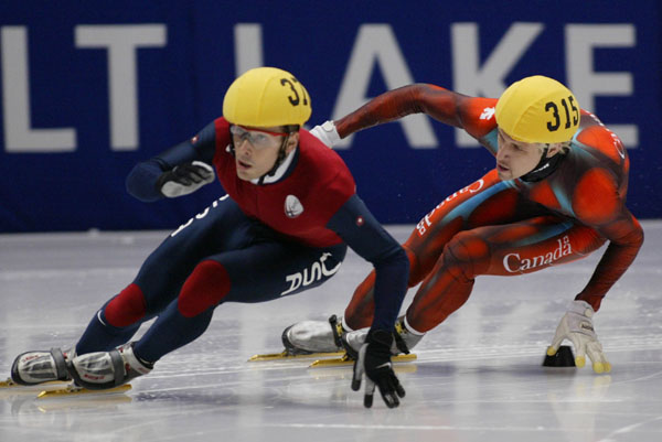 Canadian speed skater Marc Gagnon follows an americain skater during the Men's 500 metre at the 2002 Olympic Winter Games in Salt Lake City. (CP Photo/COA/Andre Forget).