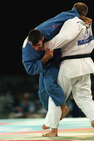 Canada's Nicolas Gill (L) during a match at the Taekwondo portion of the Sydney 2000 Olympic Games. (CP PHOTO/ COA)