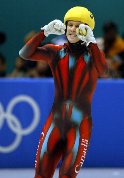 Canadian short track speed skater Jonathan Guilmette pumps his fist after winning Silver at the men's 500 metre Saturday Feb. 23, 2002 at the 2002 Olympic Winter Games in Salt Lake City.  (CP Photo/COA/Andre Forget).