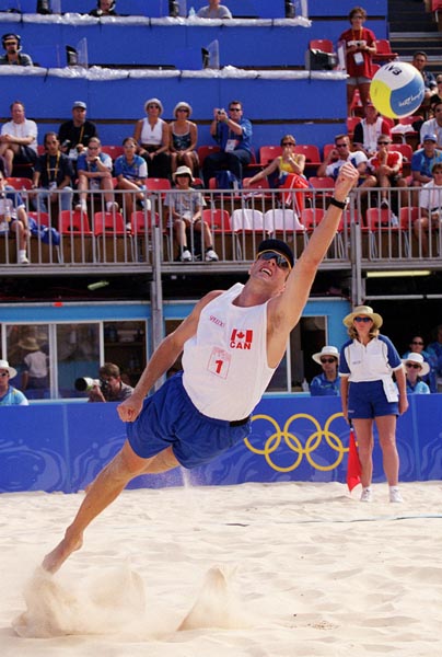 Canada's Jody Holden punches the ball in the air during the volleyball tournament at the Sydney 2000 Olympic Games. (CP PHOTO/ COA)