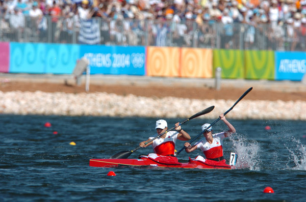 Canada's Caroline Brunet (front) and Mylanie Barre race in the K2 500m final at the Athens 2004 Summer Olympic Games Saturday August 28, 2004. The pair finished seventh in the final. (CP PHOTO 2004/Andre Forget/COC)