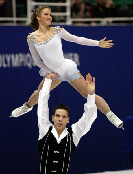 Jacinthe Lariviere soars above her partner Lenny Faustino during the pairs free skate at the Olympic Winter Games in Salt Lake City, Monday Feb. 11, 2002. (CP PHOTO/COA/Andr Forget).