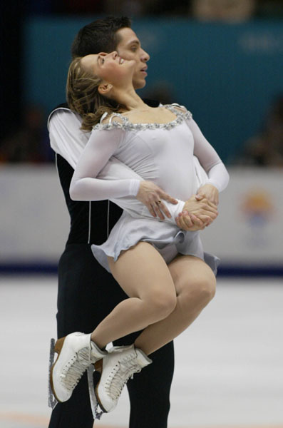 Jacinthe Lariviere, from Princeville, Que., and her partner Lenny Faustino, of Toronto, during the pairs free skate at the Olympic Winter Games in Salt Lake City, Monday Feb. 11, 2002. (CP PHOTO/COA/Andr Forget).