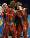 Canadian Short Track speed skaters celebrate after winning gold in the Men's 5000 metre Relay Saturday Feb. 23, 2002 at the 2002 Olympic Winter Games in Salt Lake City. (CP Photo/COA/Andre Forget).