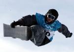 Canada's Daniel Migneault of Quebec City pulls a trick while riding the half pipe at Park City, Utah Monday  Feb. 11, 2002 at the Salt Lake City 2002 Winter Olympics. (CP PHOTO/HO/COA/Andre Forget)
