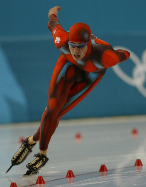 Team Canada's long track speed skater Dustin Molicki powers on to beat teammate Mark Knoll for the Canadian record with a time of 6:26.29 in the 5,000 metre mens final at the 2002 Olympic Winter Games in Salt Lake City, Utah Saturday Feb 9, 2002. (CP Photo/AOC/ Andre forget).