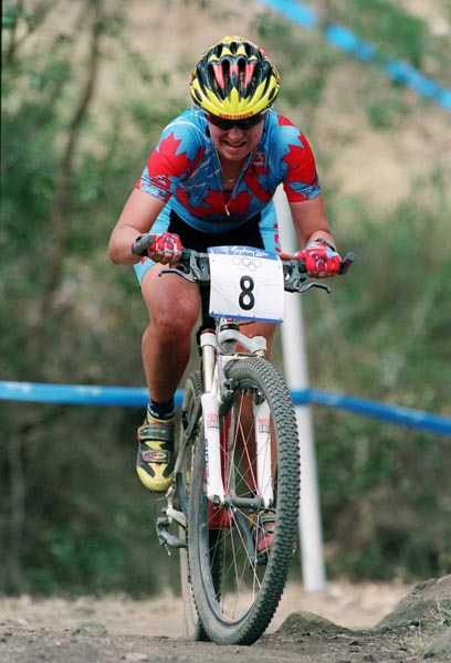 Canada's Chrissy Redden cycles her way to the top of a hill during the Sydney 2000 Olympic Games. (CP PHOTO/ COA)