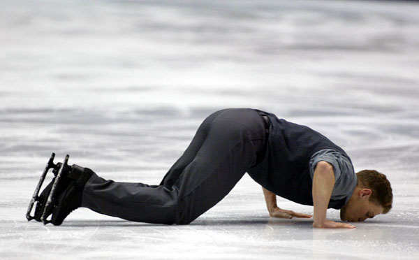 Canadian David Pelletier kisses the ice after completing his Pairs Free Skating with Jamie Sale (not shown) in Salt Lake City, Utah Monday Feb. 11, at the 2002 Olympic Winter Games. (CP Photo/COA/Andre Forget).