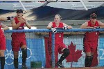 La canadienne Erin White (#2) se prpare  frapper la balle alors que Sasha Olson (#7) et Sheena Lawrick (#4) sont sur le banc et encouragent l'quipe lors du match prliminaire contre Taipei le 14 aot 2004 aux Jeux olympiques d'Athnes.  (CP PHOTO)2004(COC-Mike Ridewood)