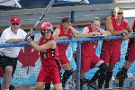 Canada's Erin White (#2) gets ready to bat while Sasha Olson (#7) and Sheena Lawrick (#4) are on the bench cheering for the team during the preliminary game against Taipei on August 14, 2004 at the Olympic Games in Athens.  (CP PHOTO)2004(COC-Mike Ridewood)