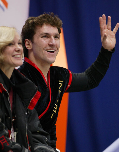 Canadian Figure Skater Elvis Stojko (with his coach Uschi Kesler) pulls a face after hearing his marks after the Men's Short Program in Salt Lake City, Utah Tuesday Feb. 12, at the 2002 Olympic Winter Games. (CP Photo/COA/Andre Forget).