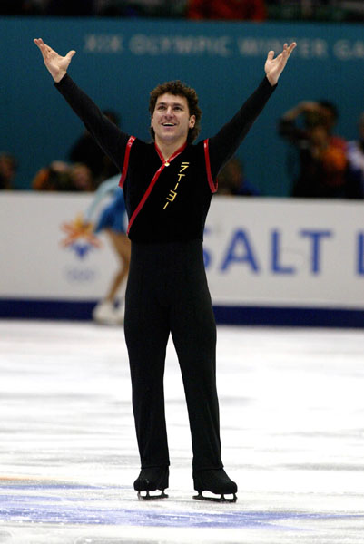 Canadian Figure Skater Elvis Stojko is all smiles after finishing his Mens Short Program in Salt Lake City, Utah Tuesday Feb. 12, at the 2002 Olympic Winter Games. (CP Photo/COA/Andre Forget).