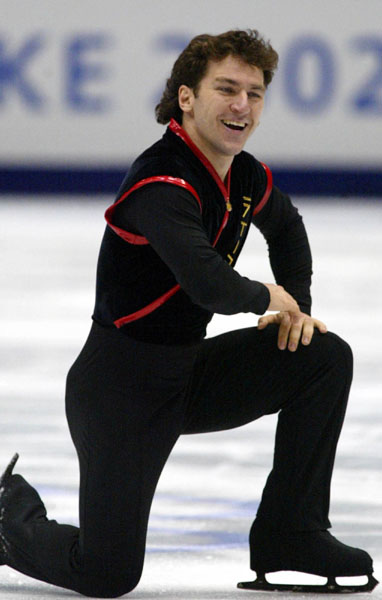Canadian Figure Skater Elvis Stojko is all smiles after finishing his Men's Short Program in Salt Lake City, Utah Tuesday Feb. 12, at the 2002 Olympic Winter Games. (CP Photo/COA/Andre Forget).