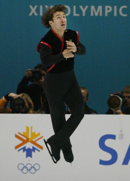 Canadian Figure Skater Elvis Stojko performs a jump during the men's short program in Salt Lake City, Utah Tuesday Feb. 12, at the 2002 Olympic Winter Games. (CP Photo/COA/Andre Forget).