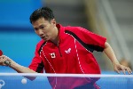 Canada's Johnny Huang of Toronto hits a shot during his loss to Aleksandar Karakasevic of Serbia and Montenegro in men's table tennis at the Summer Olympic Games in Athens, Greece, Monday, August 16, 2004. (CP PHOTO/COC/Mike Ridewood)