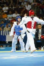 Canada's Ivett Gonda from Port Moody, B.C. competes in the under 49kg taekwondo repechage at the Summer Olympic Games in Athens, Greece on Thursday August 26, 2004. Canada's Gonda was eliminated by Boorapolchai who moved on to compete for the bronze medal. (CP PHOTO/COC/Mike Ridewood)