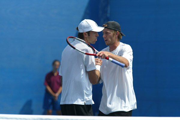 Frederic Niemeyer (right) of Campbellton, N.B. and Daniel Nestor of Willowdale, Ont. after their win in the first round of doubles tennis against Slovakia at the Olympic Games in Athens, Sunday, August 15, 2004. (CP PHOTO/COC-Mike Ridewood)