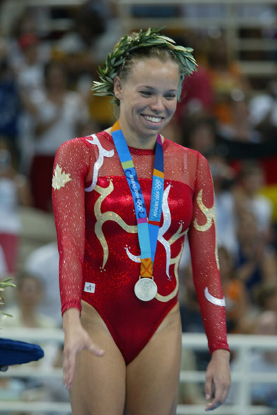 Canada's Karen Cockburn of Toronto with her silver medal in women's trampoline at the Olympic Games in Athens on Friday, August 20, 2004. (CP PHOTO)2004(COC-Mike Ridewood)