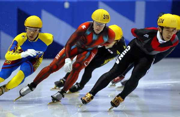 Canadian short track speed skater Mathieu Turcotte (319) during an event in Salt Lake City at the 2002 Olympic Winter Games. (CP Photo/COA/Andre Forget).