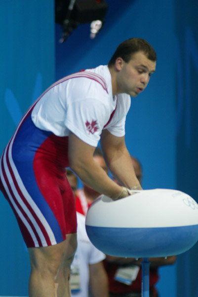 Canada's Akos Sandor of Mississauga, Ont. gets ready for his lift in the men's 105 kg weightlifting competition at the Olympic Games in Athens, Tuesday, August 24, 2004. (CP PHOTO/COC-Mike Ridewood)