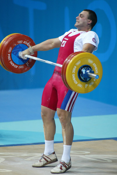 Canada's Akos Sandor of Mississauga, Ont. during his lift in the men's 105 kg weightlifting competition at the Olympic Games in Athens, Tuesday, August 24, 2004. (CP PHOTO/COC-Mike Ridewood)