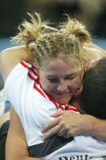 Canada's wrestler Christine Nordhagen congratulates her opponent at the Olympic Games in Athens on August 23, 2004.  Nordhagen finished fifth. (CP PHOTO)2004(COC-Mike Ridewood)