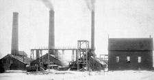 Photograph of a row of three buildings equipped with large smokestacks, number 1 slope, Springhill mine, Nova Scotia, 1897