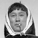 Photograph of Barnabus Arnasungaaq smoking, Beverly Lake, Nunavut, 1949