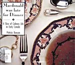 Cover of cookbook, MACDONALD WAS LATE FOR DINNER: A SLICE OF CULINARY LIFE IN EARLY CANADA, featuring a colour photograph of a place set with silver and fancy china, and a gold pocket watch