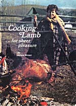 Cover of cookbook, COOKING LAMB FOR SHEER PLEASURE, with a photograph of Madame Benoit roasting a lamb on a spit over an open fire

