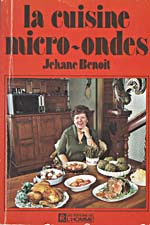 Cover of cookbook, LA CUISINE MICRO-ONDES, with a photograph of Madame Benoit seated at a table covered with food. A microwave is visible in the background